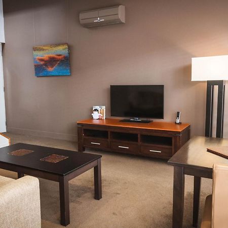 The Henry Jones Art Hotel Hobart Exterior foto A living room in a typical apartment at the Village at Grand Traverse Commons